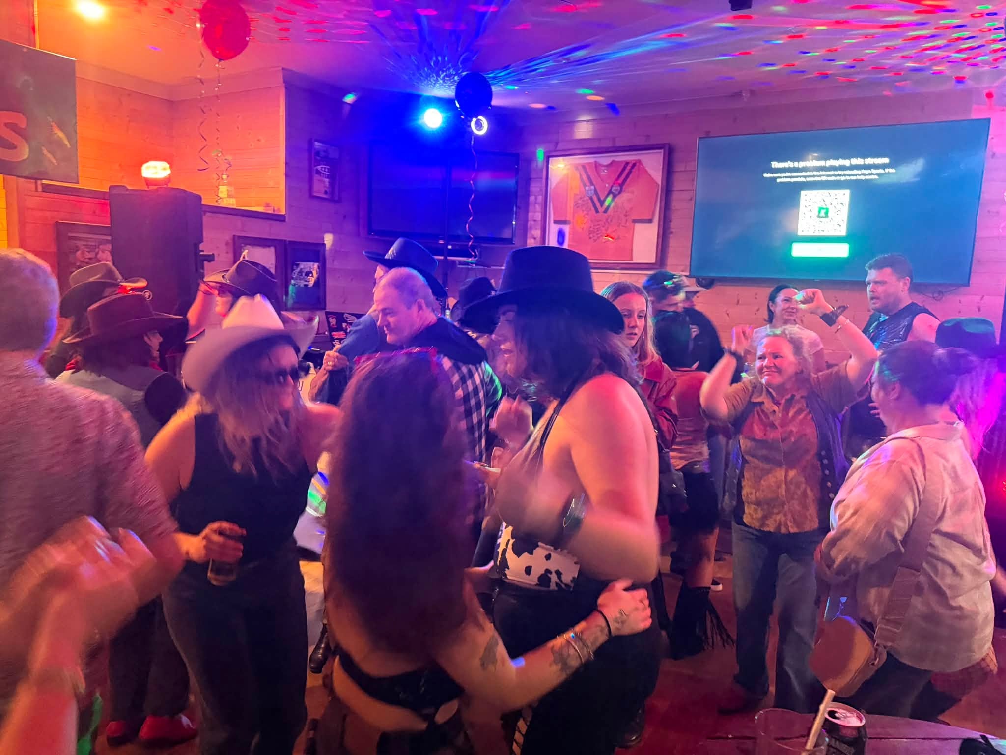 Busy dance floor with colourful lighting