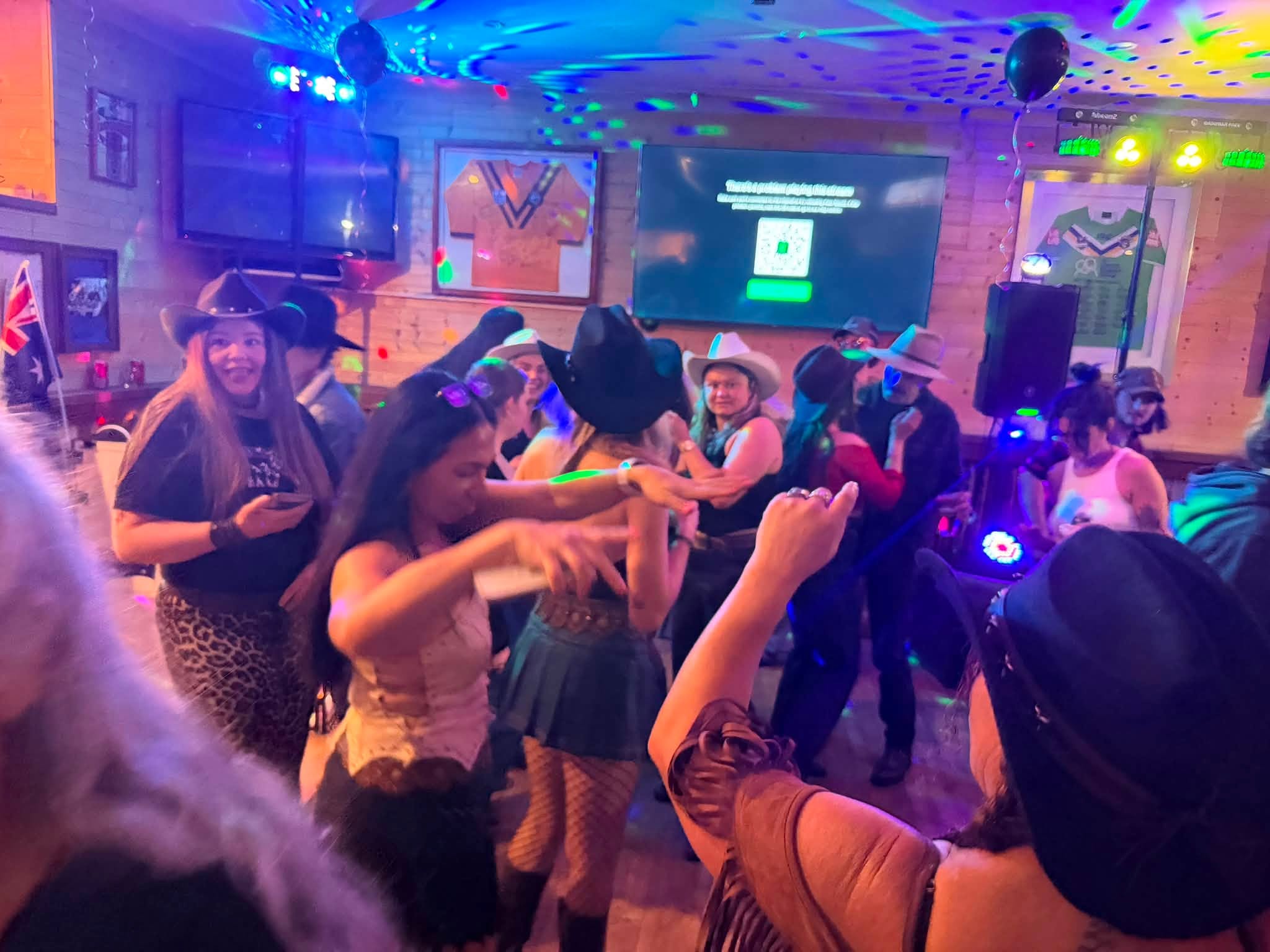 Guests dancing at a colourful event