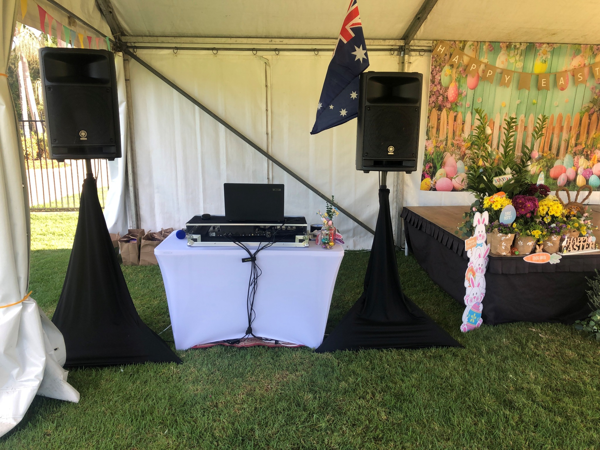 DJ Gazza outdoor event setup with speakers and laptop